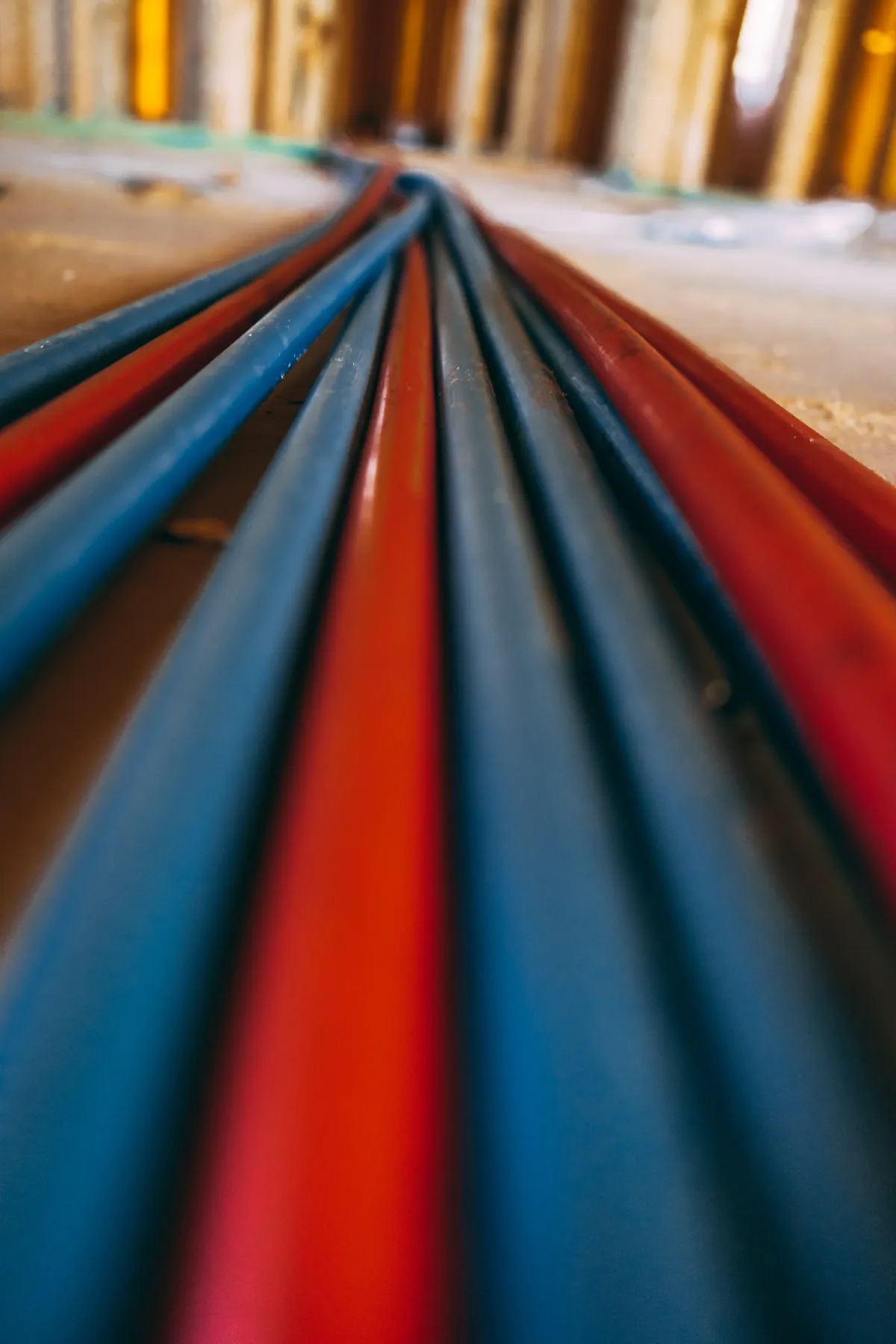 Coiled red and blue PEX tubing ready for a repipe – Navien Tankless Water Heater Installation, Aliso Viejo Edition for Aliso Viejo, CA homes
